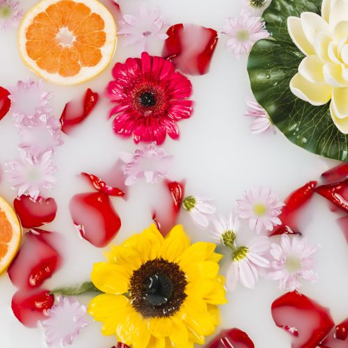 elevated-view-spa-bath-with-milk-decorated-by-grapefruit-flowers